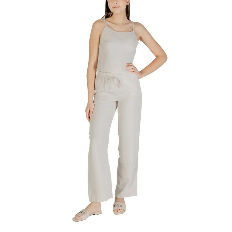 Beige sleeveless round neck polyester top with thin straps paired with matching wide-leg pants featuring a drawstring waist