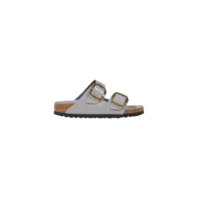 Light gray Birkenstock womens leather slippers with gold buckles and cork footbed