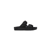 Black birkenstock women slippers with two adjustable straps and contoured footbed made of black rubber