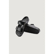 Black birkenstock arizona sandals with glossy finish and two adjustable straps in women’s size 3 slippers