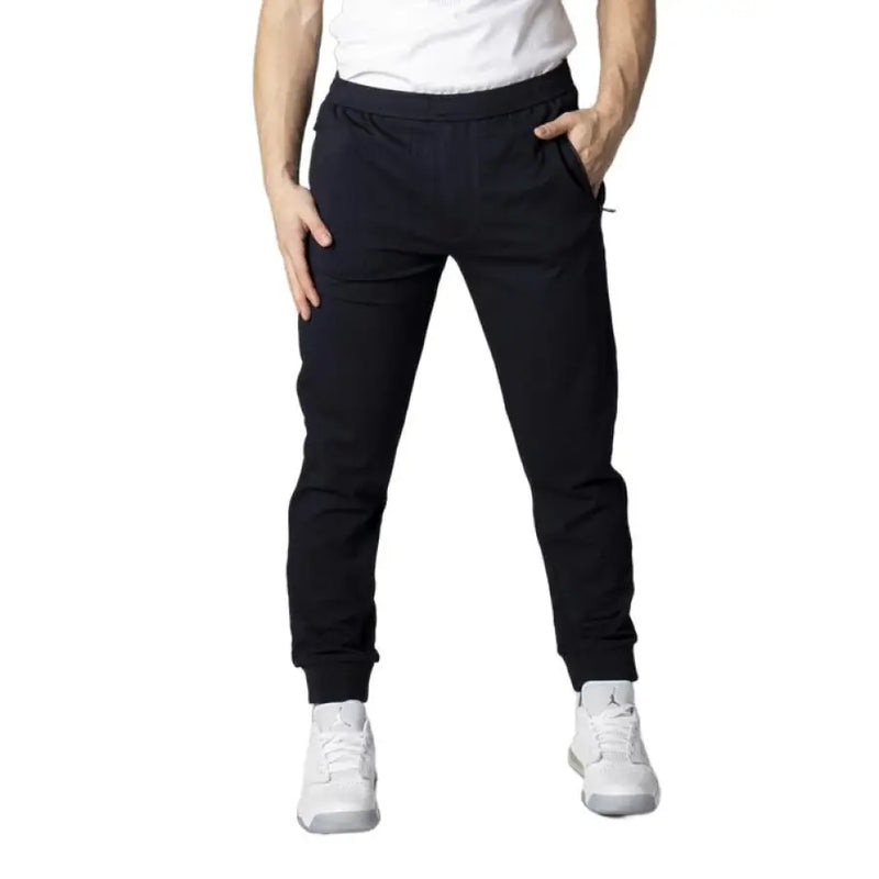 Dark Blue Men’s Trousers and Black Athletic Sweatpants displayed in a retail setting