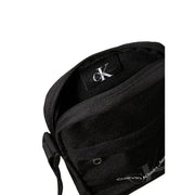 Black Calvin Klein crossbody bag with zipper closure featured in Men’s Shoulder Bag