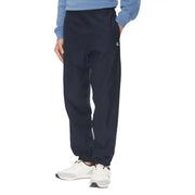 Schwarze Calvin Klein Jogginghose mit elastischen Bündchen und dunkelblauem Bein mit dezentem weißen Logo am linken Bein