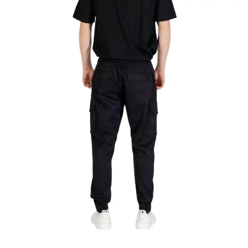 Black cargo pants displayed as part of the Black Hooded Shirt and Cargo Pants Outfit