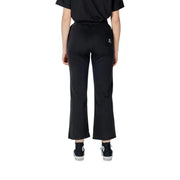 Black Cropped Flare Pants displayed with stylish Black Converse footwear