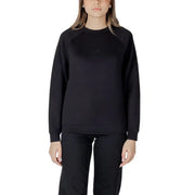 Women’s light blue sweatshirt and black pants set displayed for casual wear