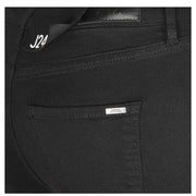 Black Skinny Denim Jeans displayed in a stylish fashion setting