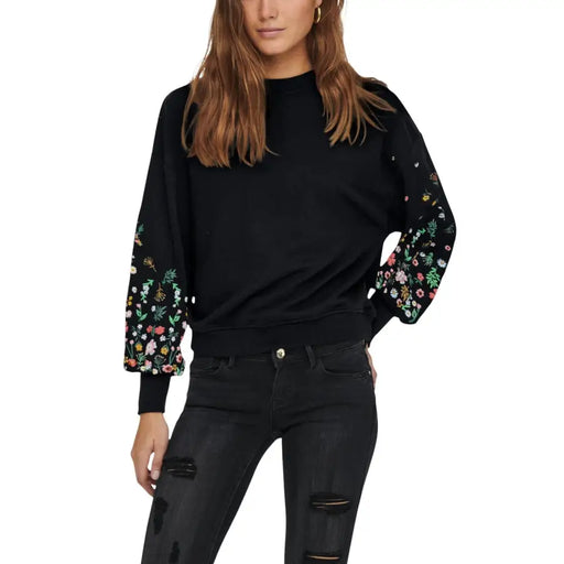 Black floral round neck sweatshirt for women with colorful floral embroidery on the sleeves in black fabric