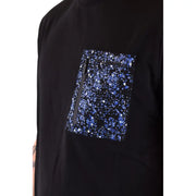 Black graphic tee shirt with a vibrant blue glittery starburst patterned pocket and a black zipper on the chest