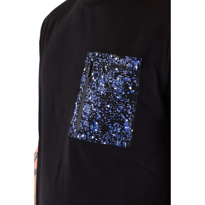 Black graphic tee shirt with a vibrant blue glittery starburst patterned pocket and a black zipper on the chest