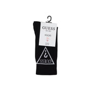 Black Guess sock in black featuring a white triangular logo with brand name and hook symbol displayed on a hanger