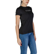Black Guess T-shirt paired with blue jeans from Guess Active Women Spring Summer collection