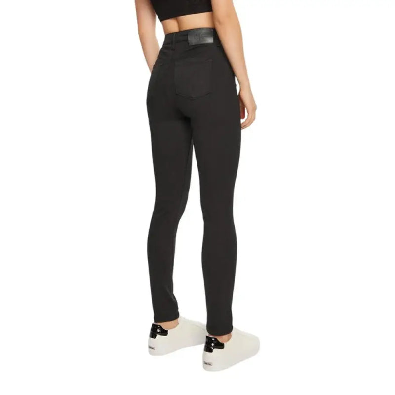 Calvin Klein black high-waisted skinny jeans displayed for fashion shopping