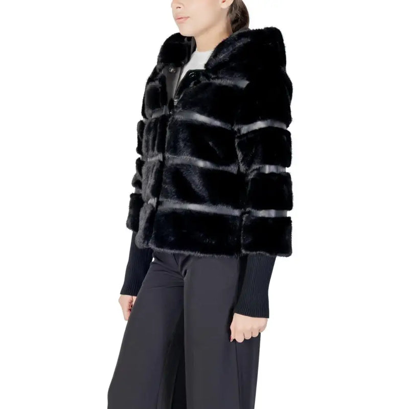 Black hooded polyester blazer for women featuring a black faux fur puffer jacket with horizontal ribbed detailing