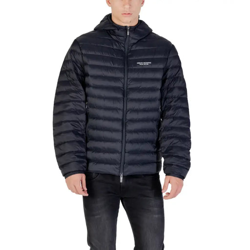 Black hooded puffer jacket in quilted design with subtle white logo on the chest for cold weather use