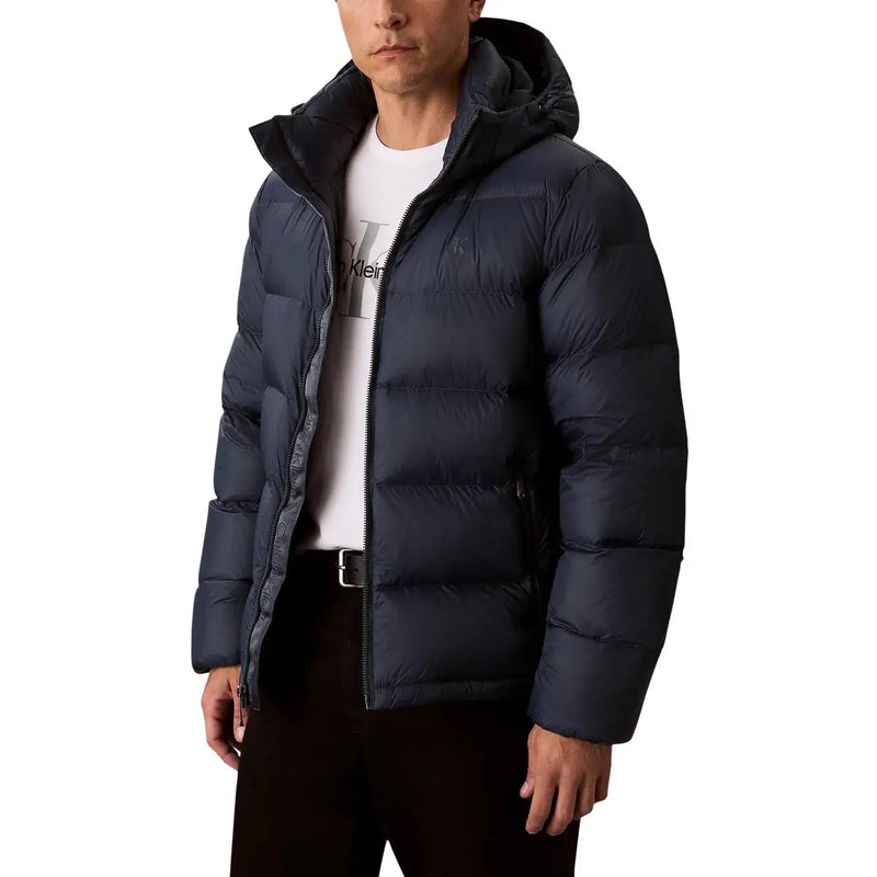 Black hooded puffer jacket in dark navy with quilted design and insulated hood for cold weather protection