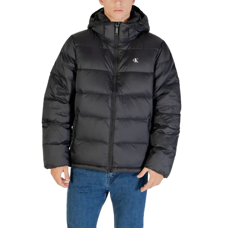 Black hooded puffer jacket displayed on a mannequin for men’s winterwear collection