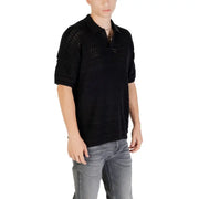 Black knit polo shirt displayed in a product image showcasing stylish men’s apparel