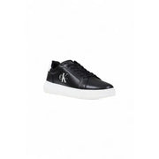 Black leather Calvin Klein sneaker with white sole displayed in product image