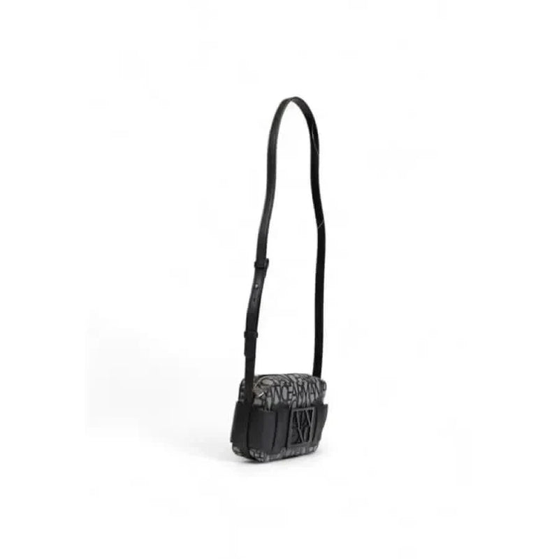 Black leather crossbody bag with textured flap and adjustable strap by Armani Exchange