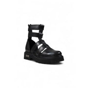 Black leather gladiator style platform boot featuring crisscross straps and a chunky sole for bold fashion