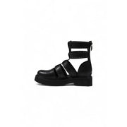 Black leather gladiator style ankle boot with crisscross straps and a chunky platform sole