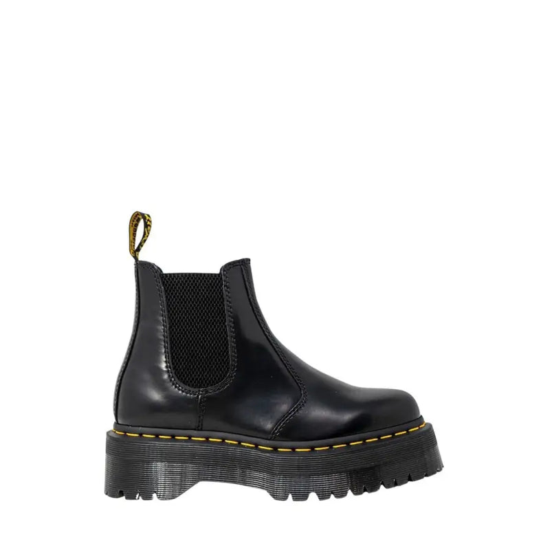 Black leather platform chelsea boot showing the back side with smooth polished finish and sturdy sole