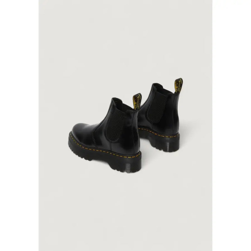 Black leather platform Chelsea boot in patent leather with yellow stitching and chunky rubber sole