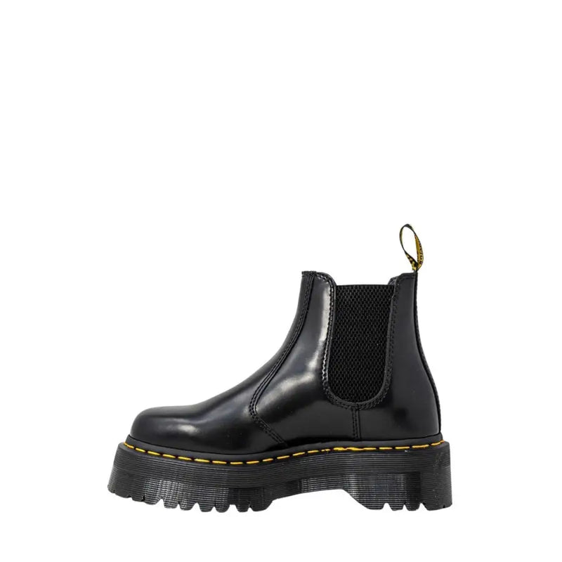 Black leather platform Chelsea boot showing the back side with sleek design and sturdy sole