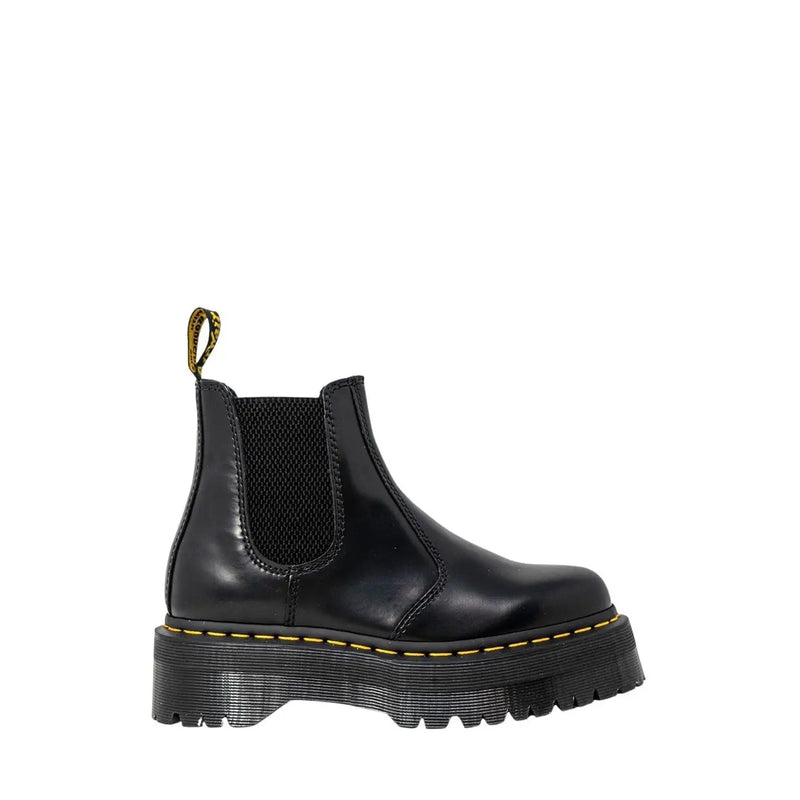 Black leather platform chelsea boot showing the back side with smooth polished finish and sturdy sole