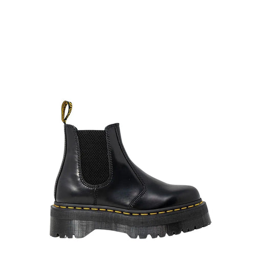 Black leather platform chelsea boot showing the back side with smooth polished finish and sturdy sole