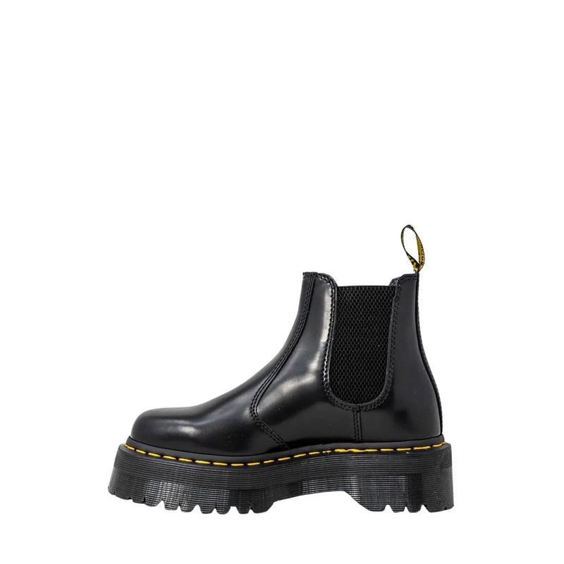 Black leather platform Chelsea boot showing the back side with sleek design and sturdy sole