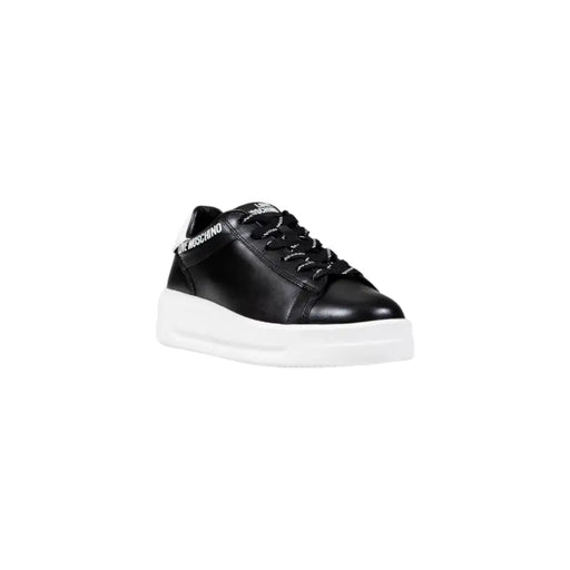Black leather platform sneakers with white soles and black and white laces by Love Moschino