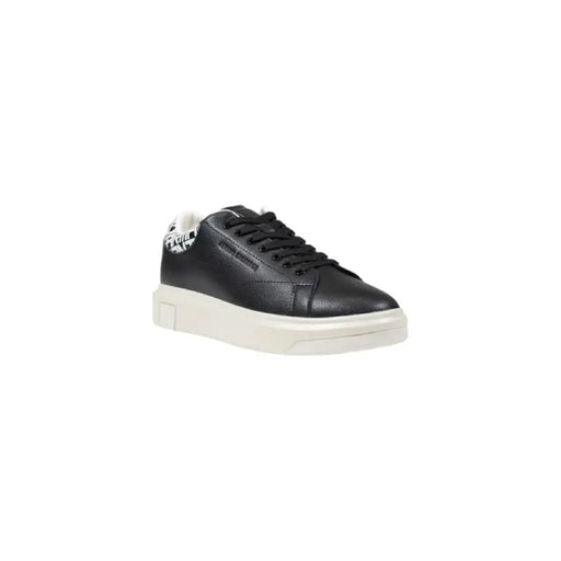Black leather sneaker with patterned heel and white sole for stylish comfort