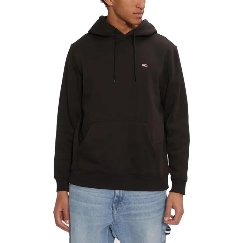 Black long hooded tommy hilfiger sweatshirt with small chest logo and front pockets for fall winter wear