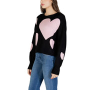 Black long sleeve round neck viscose knit top for women featuring a black knit sweater with pink heart patterns