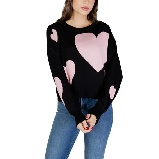 Black long sleeve viscose knit top with pink heart patterns