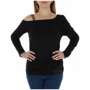 Black off-shoulder long sleeve top with embellished strap displayed in product listing
