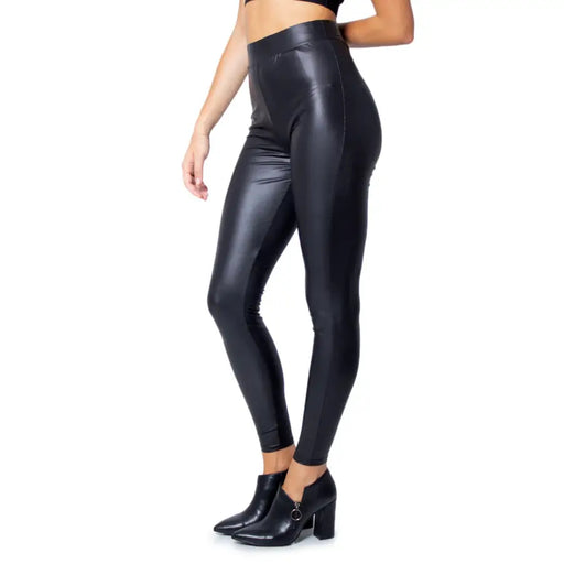 Black high-waisted faux leather leggings with a sleek shiny finish made of polyester elastane for fall and winter use