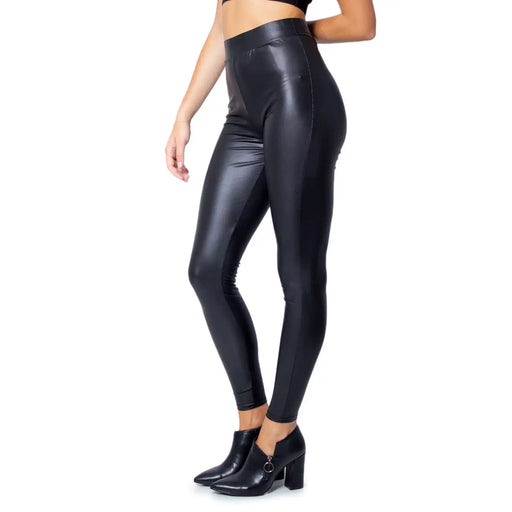 Black high-waisted faux leather leggings with a sleek shiny finish made of polyester elastane for fall and winter use