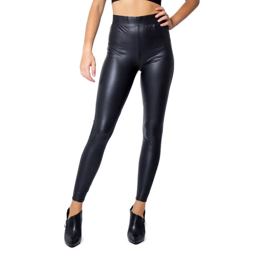 Black polyester elastane women leggings with a shiny faux-leather finish high waisted for fall and winter wear