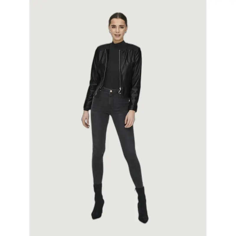 Black polyurethane long blazer for women featuring a high collar, silver zippers, and faux leather bomber jacket style