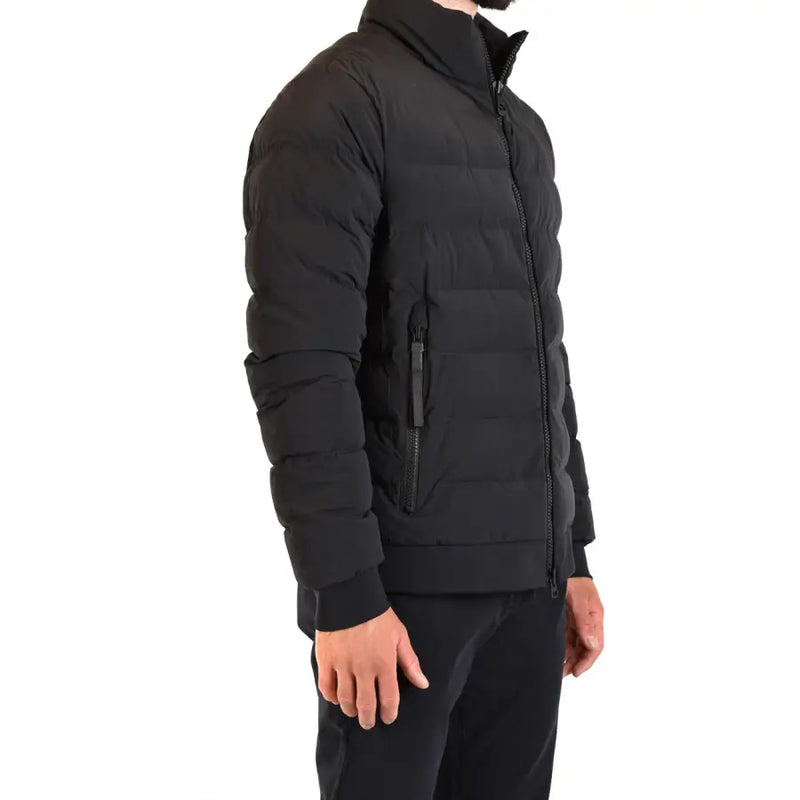Black quilted puffer jacket with high collar and zippered pockets for warmth and style
