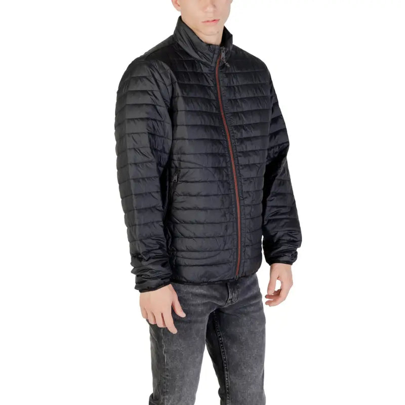 Black quilted puffer jacket with a reddish brown zipper made from insulated material for cold weather wear
