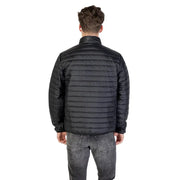 Black quilted puffer jacket with high collar and subtle stitching details for warmth and style