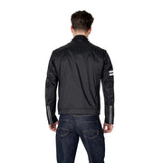 Black racing style jacket showing the back with reflective white stripes on sleeves and shoulders for enhanced visibility
