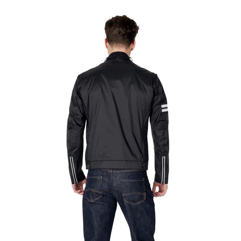 Black racing style jacket showing the back with reflective white stripes on sleeves and shoulders for enhanced visibility