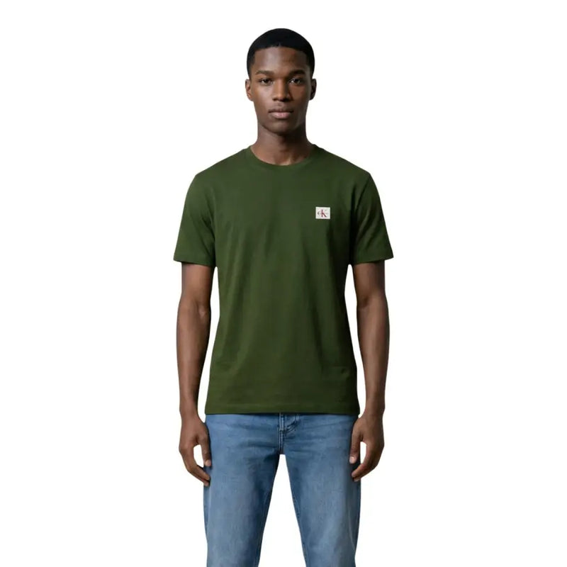 Black short sleeve crewneck t-shirt in olive green cotton with a small white Calvin Klein logo patch on the left chest