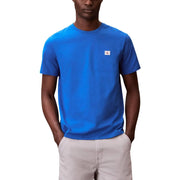 Black short sleeve crewneck t-shirt featuring a bright blue Calvin Klein fabric with a small white logo patch on the left chest