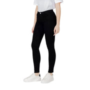 Black skinny jeans with a sleek, form-fitting design and high-waisted style in a smooth black fabric